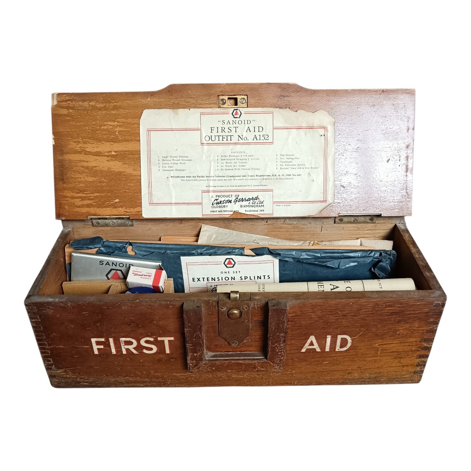 Open vintage Sanoid first aid kit showing contents.