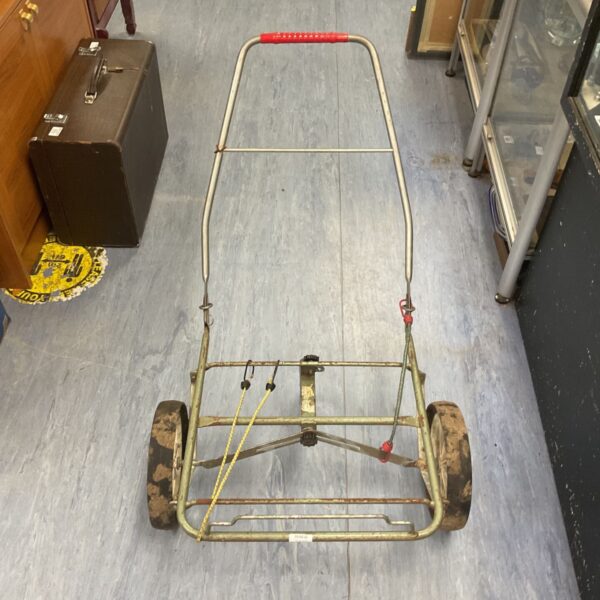 Vintage folding fishing tackle trolley with spoked wheels.