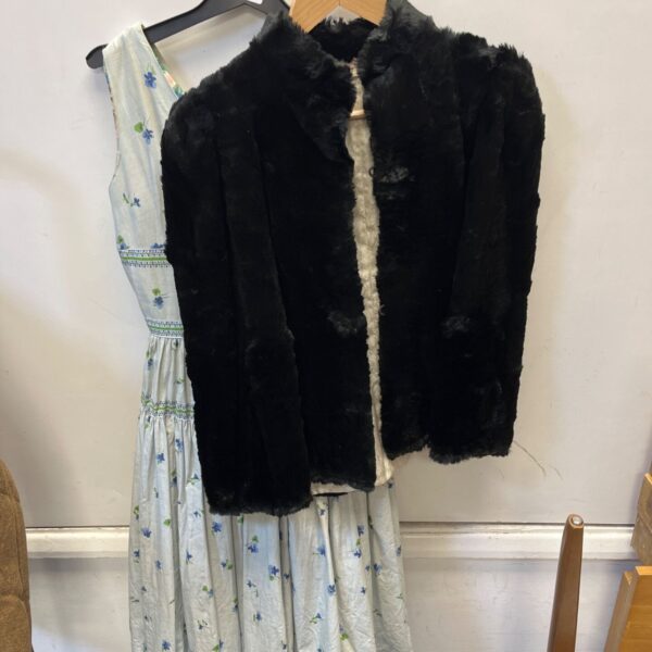 Vintage ladies dress and black faux fur jacket, 1970s style.