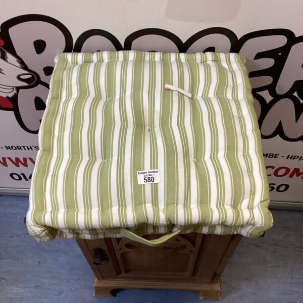 Vintage floral seat cushion with pink and cream flowers.