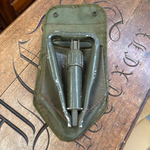 Vintage folding spade, a metal garden tool in used condition.