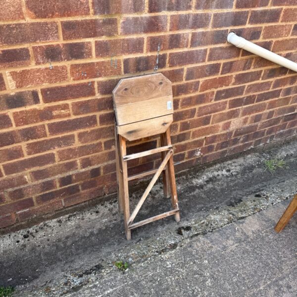 Vintage wooden folding step stool, a rustic and functional antique.