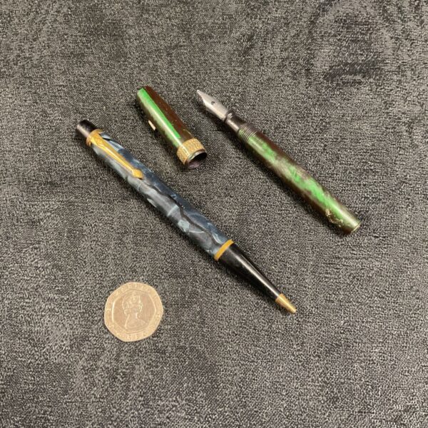 Vintage marbled fountain pen and propelling pencil set in case.
