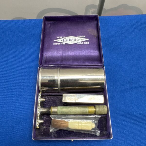 Open vintage Gillette shaving set showing contents.