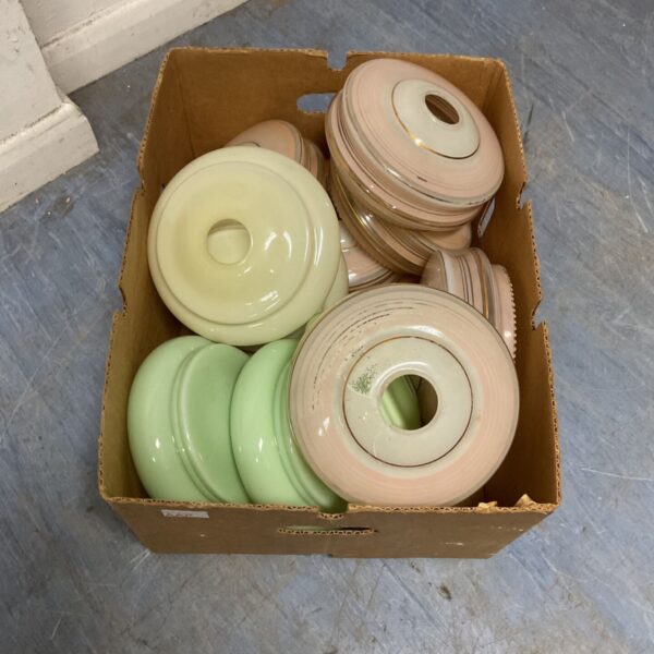 Box of vintage pastel green glass light shades.