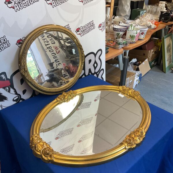 Vintage gold framed mirror, ornate wall decor, antique style.