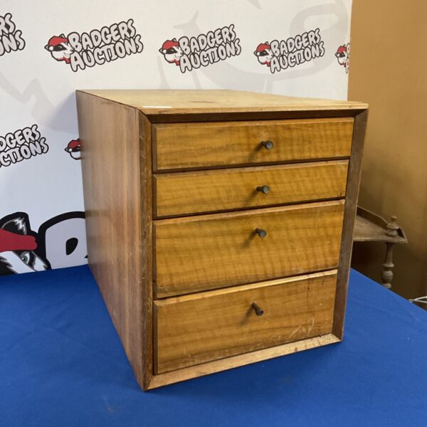 Vintage Heals oak drawers with four drawers, showing front view.