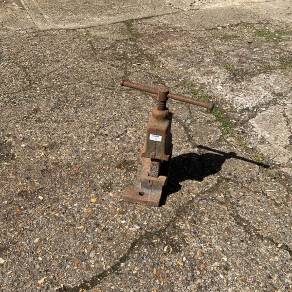 Vintage heavy duty pipe cutter in rusted condition.
