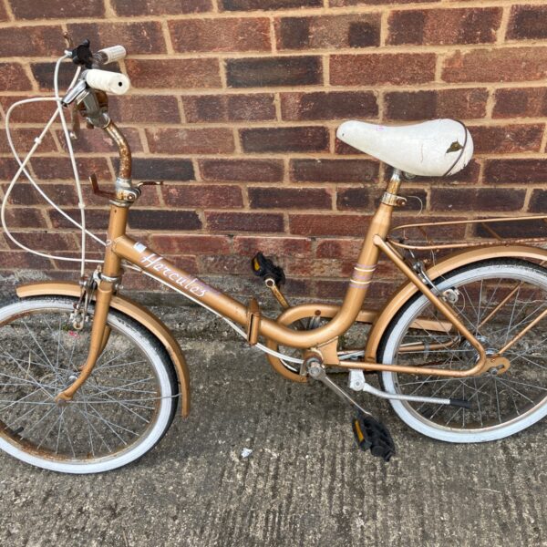 Vintage gold Hercules folding bicycle, classic retro shopper bike.