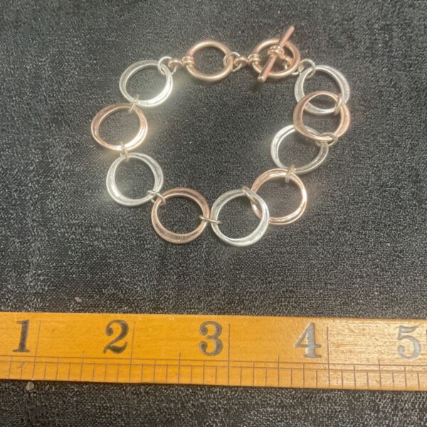 Vintage two-tone gold and silver hoop link bracelet.