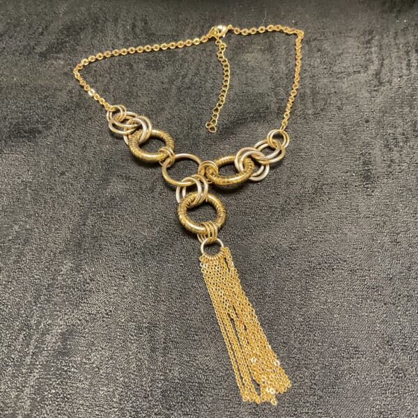 Gold vintage hoop necklace with tassel pendant, 1970s style.