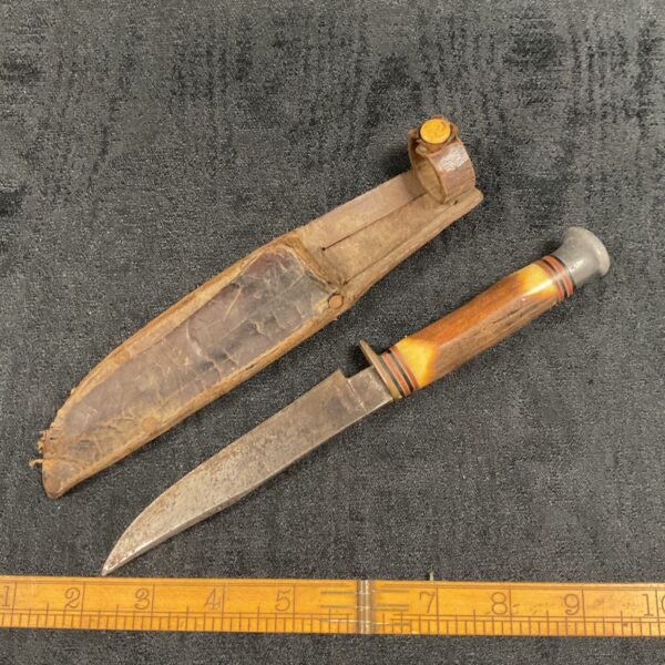 Vintage horn handle sheath knife with leather sheath.