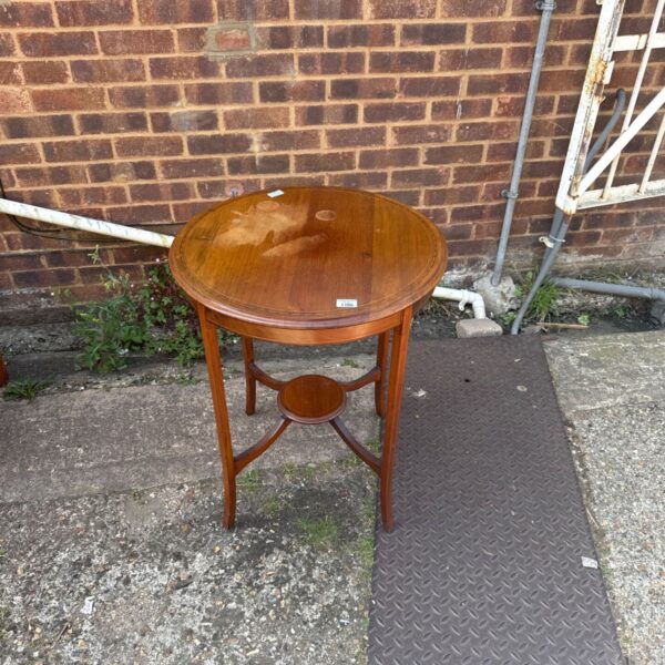 Vintage inlaid side table with water stains and curved legs.