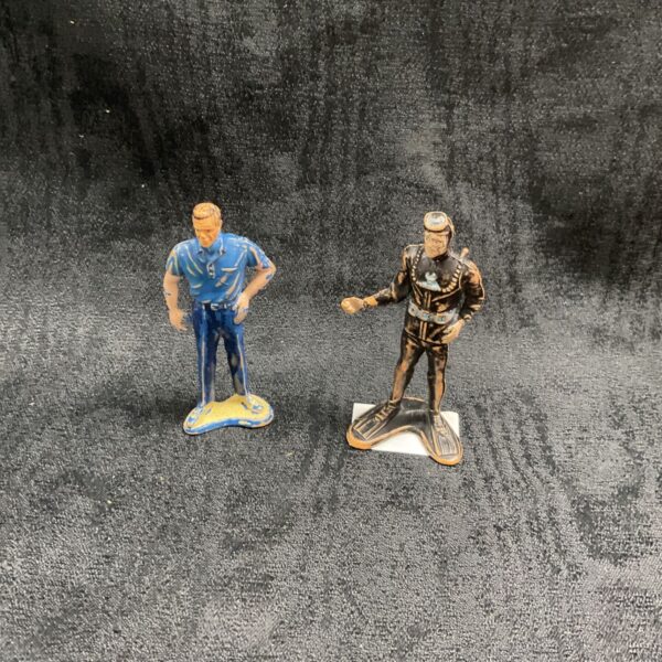 Vintage James Bond figure in blue suit, collectible toy.