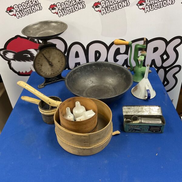 Vintage kitchenalia lot featuring a metal colander and mixing bowl.