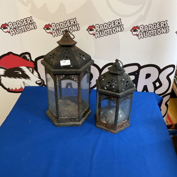 Pair of vintage metal lanterns with pierced detailing.