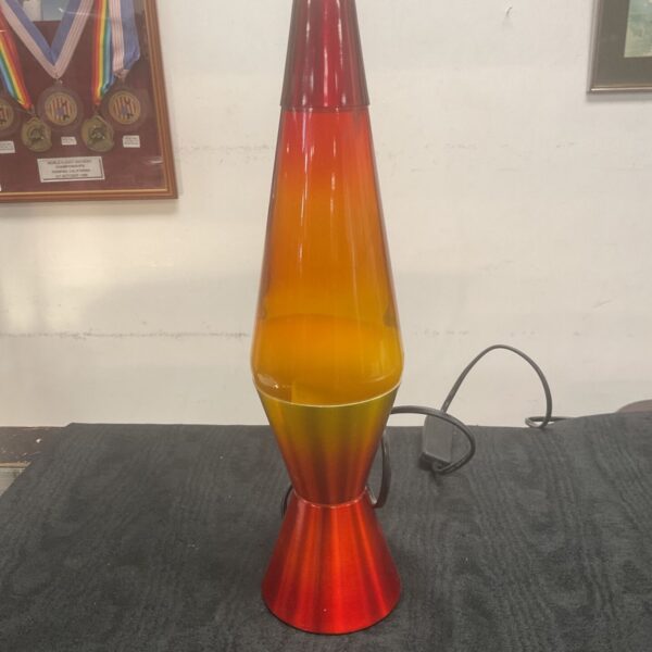Vintage orange and red lava lamp, a retro lighting collectible.