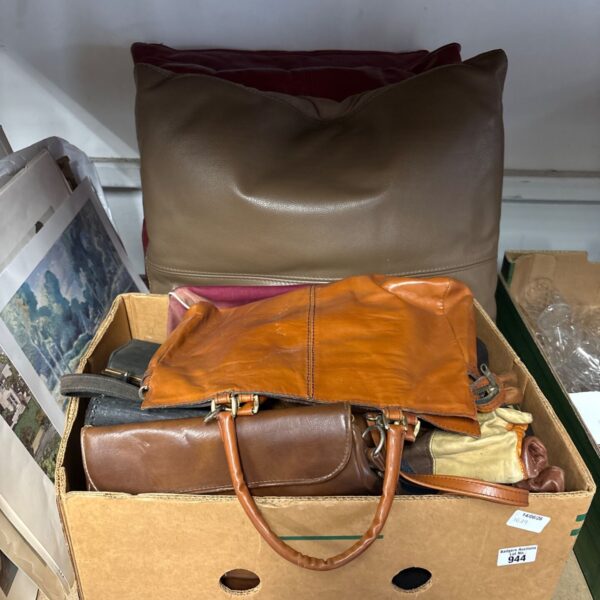 Brown vintage leather handbag with a top handle.