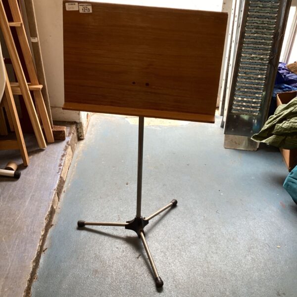 Vintage wooden lectern with metal base for reading or display.