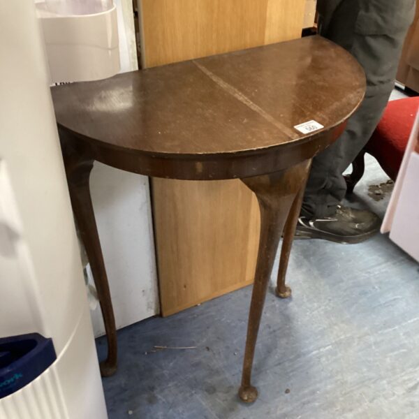 Vintage mahogany demi-lune hall table with elegant tapered legs.