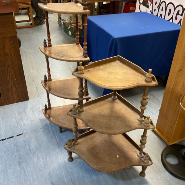 Pair of vintage mahogany whatnots for displaying collectibles.