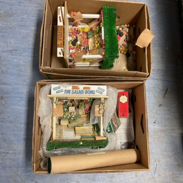 Vintage market stall models with produce display.