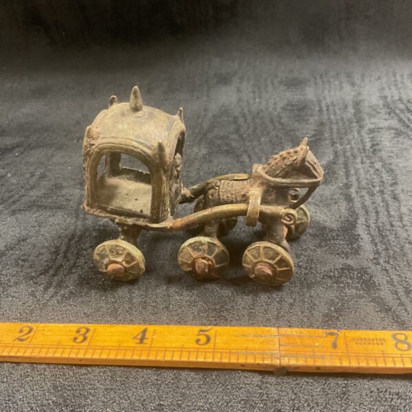 Vintage Asian metal horse drawn carriage, detailed antique collectible.