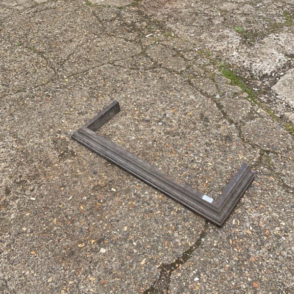 Vintage metal fire fender for fireplace hearth protection.