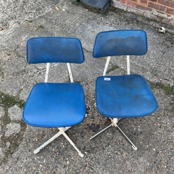 Blue vintage mid-century swivel chair with chrome base.