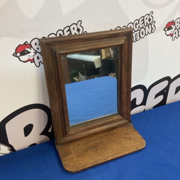 Vintage oak shaving mirror with folding shelf, wall mounted.