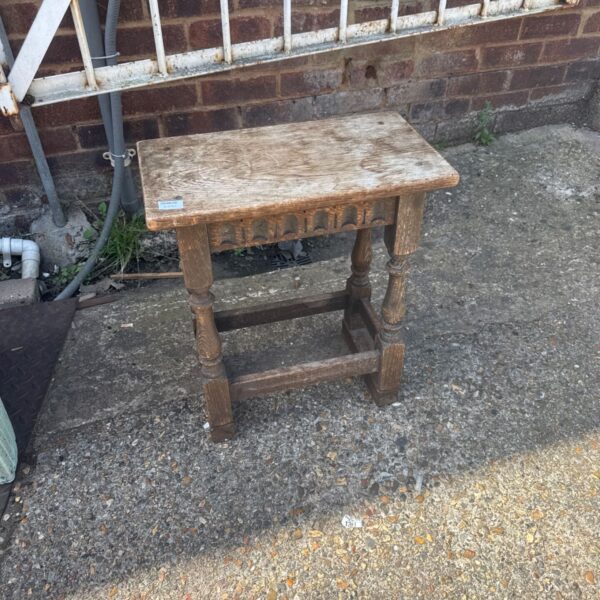 Vintage oak side table with turned legs, ideal for hallway or bedroom.