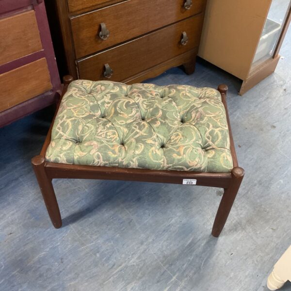 Vintage padded stool with floral tapestry upholstery and turned legs.