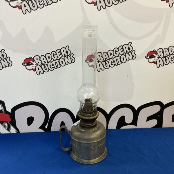 Vintage pewter oil lamp with glass shade for antique lighting.