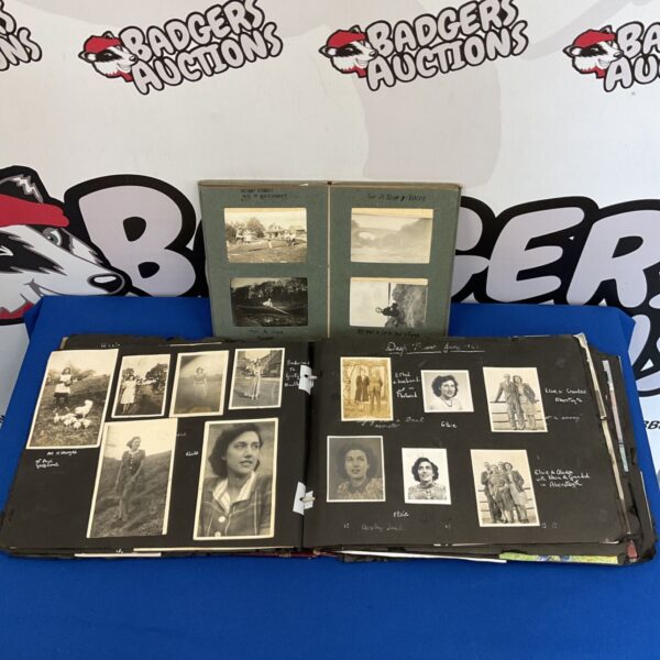Overview of vintage photograph albums and loose photos.