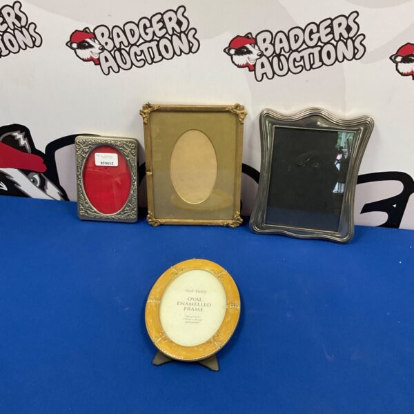 Lot of four vintage photo frames in various styles.