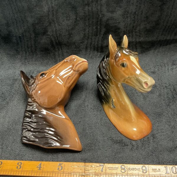 Vintage porcelain horse head figure with detailed mane.