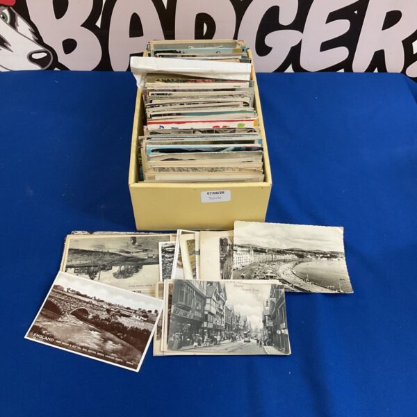 Box of vintage postcards for collectors of antique paper ephemera.