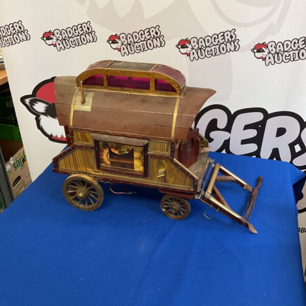 Vintage wooden Romany Gypsy caravan model with painted details.