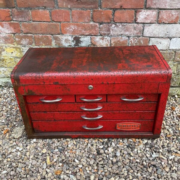 Red vintage Roto Pro tool cabinet with five drawers.