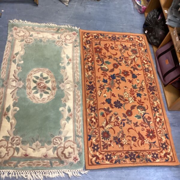 Green floral vintage rug, part of a pair.