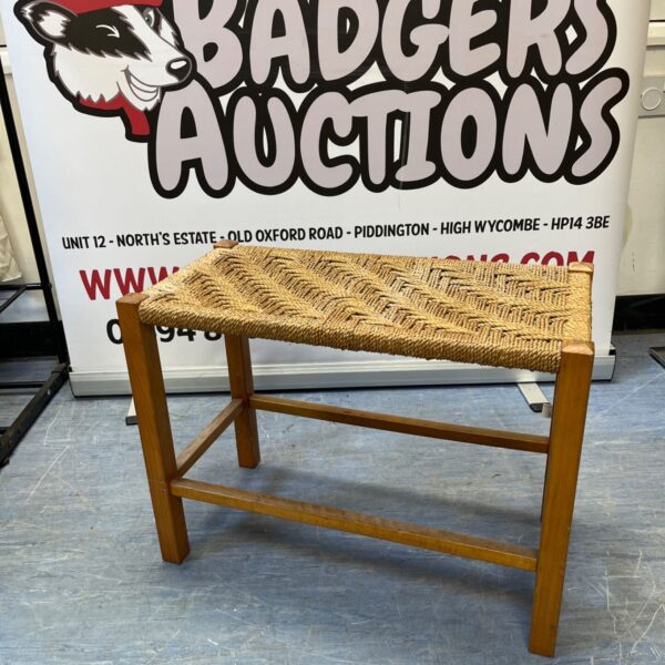 Vintage rush seat stool with wooden legs and woven seat.