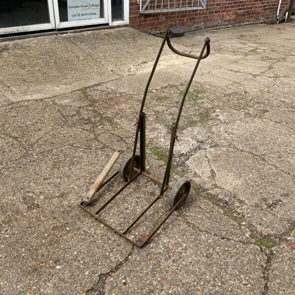 Vintage steel sack barrow with two wheels, showing signs of age.