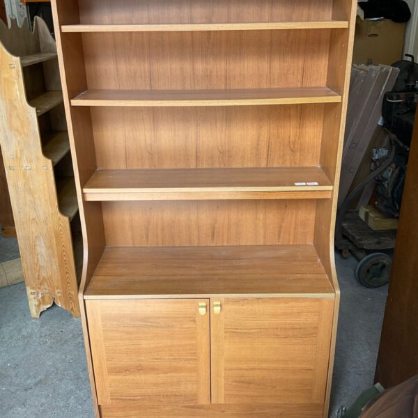 Vintage Schreiber teak bookcase with open shelving and cupboard.