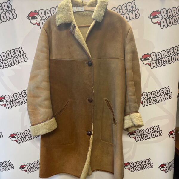 Vintage sheepskin coat with shearling collar, warm winter outerwear.