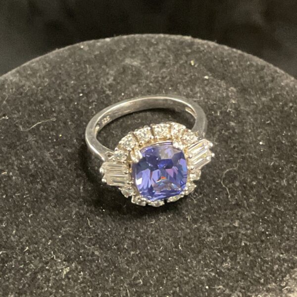 Vintage silver ring with a blue violet cushion cut stone.