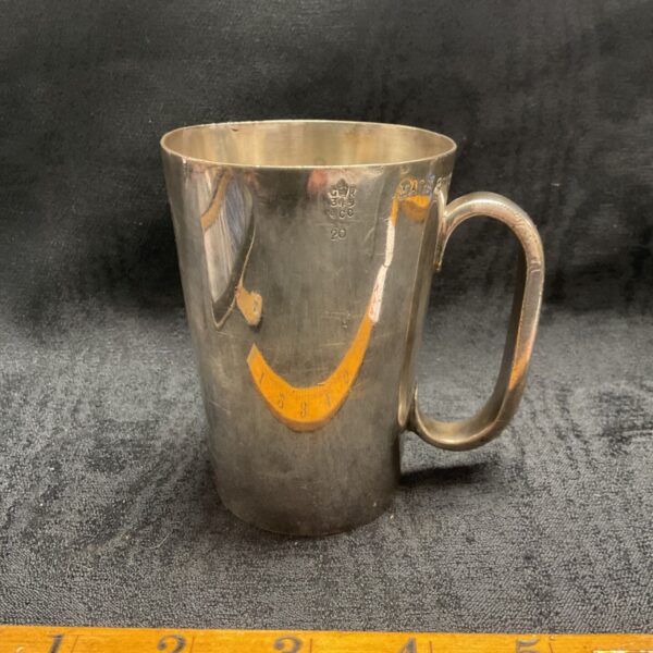 Vintage silverplate half pint tankard with handle, showing wear.