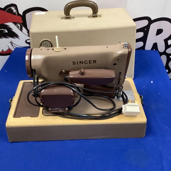 Vintage Singer sewing machine, mid-century retro style.