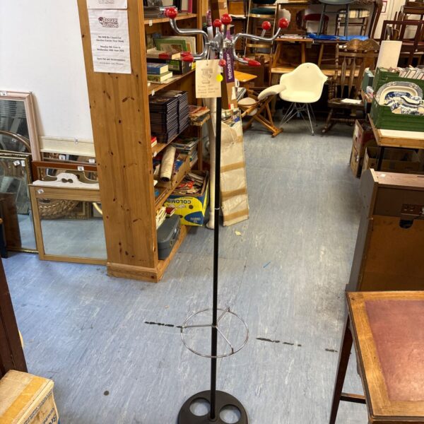 Vintage 1960s Sputnik coat rack in a cluttered room.