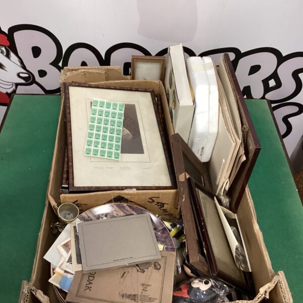 Vintage stamp and picture collection with old photographs and frames.