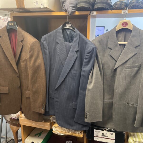 Vintage suit jackets and trousers lot, 1970s menswear collection.